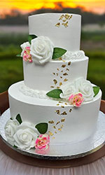 White with Peach and Green Wedding Cake